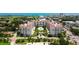 This aerial view highlights the community's resort-style pool, manicured grounds, and white exterior at 1 John Anderson Dr # 2180, Ormond Beach, FL 32176
