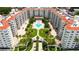 Beautiful aerial view of a condo community with a swimming pool and manicured landscaping at 1 John Anderson Dr # 2180, Ormond Beach, FL 32176