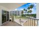Balcony view overlooking lush landscaping and the exterior of the building at 1 John Anderson Dr # 2180, Ormond Beach, FL 32176