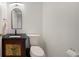 Bathroom including cabinet sink and toilet with a mirror at 1 John Anderson Dr # 2180, Ormond Beach, FL 32176