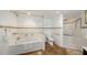 Bathroom featuring a tiled shower, soaker tub, granite trim, and tiled floors at 1 John Anderson Dr # 2180, Ormond Beach, FL 32176