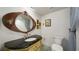Bathroom featuring a unique mirror, vanity, toilet, and tiled floors at 1 John Anderson Dr # 2180, Ormond Beach, FL 32176