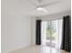 Bedroom with a ceiling fan, an exterior balcony, and neutral walls at 1 John Anderson Dr # 2180, Ormond Beach, FL 32176