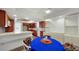Cozy breakfast nook features kitchen access and built-in storage at 1 John Anderson Dr # 2180, Ormond Beach, FL 32176