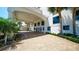 The grand entrance of this building has a covered drive and manicured landscaping. The entryway provides curb appeal at 1 John Anderson Dr # 2180, Ormond Beach, FL 32176