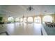 Spacious event space with chandeliers, arched windows, and plenty of natural light at 1 John Anderson Dr # 2180, Ormond Beach, FL 32176