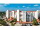 Beautiful exterior view of the condo building showcasing its balconies and well-maintained grounds with palm trees at 1 John Anderson Dr # 2180, Ormond Beach, FL 32176