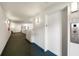 Well-lit building hallway with Elevator 1 sign at 1 John Anderson Dr # 2180, Ormond Beach, FL 32176