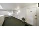 Well-lit building hallway with carpet and entry door to unit 218 at 1 John Anderson Dr # 2180, Ormond Beach, FL 32176