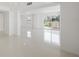Bright and open living space featuring tile floors, neutral walls, and access to a balcony at 1 John Anderson Dr # 2180, Ormond Beach, FL 32176