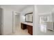 Bathroom with vanity, tile floors, mirror, and walk-in closet at 1 John Anderson Dr # 2180, Ormond Beach, FL 32176