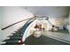 Elegant staircase with decorative railing and intricate carpet design at 1 John Anderson Dr # 2180, Ormond Beach, FL 32176