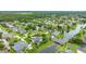 An aerial view of a community near water with lush landscaping at 101 Green Heron Ct, Daytona Beach, FL 32119