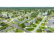 Stunning aerial view of a beautiful home in a lush neighborhood with ponds and mature landscaping at 101 Green Heron Ct, Daytona Beach, FL 32119