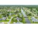 Aerial view showing a house with a screened in pool along a river at 101 Green Heron Ct, Daytona Beach, FL 32119