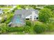 View of a screened pool in backyard with lush landscaping and privacy hedges at 101 Green Heron Ct, Daytona Beach, FL 32119