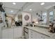 Bar area with granite countertops and mirrored backsplash is great for entertaining at 101 Green Heron Ct, Daytona Beach, FL 32119