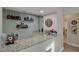 Bar area with granite countertops and custom shelving is great for entertaining at 101 Green Heron Ct, Daytona Beach, FL 32119