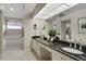 Bright bathroom with a large mirror, dual sinks, lots of counterspace, and a tub at 101 Green Heron Ct, Daytona Beach, FL 32119