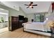 Primary bedroom with beautiful decorations, lots of space, and a view into the primary bathroom at 101 Green Heron Ct, Daytona Beach, FL 32119