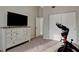 Bedroom with a dresser, closet, and exercise equipment, perfect for an active lifestyle at 101 Green Heron Ct, Daytona Beach, FL 32119