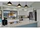 Modern kitchen with stainless steel appliances, a large island, and plenty of countertop space at 101 Green Heron Ct, Daytona Beach, FL 32119