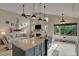 Open concept kitchen features a large island with granite countertop and seating with an eat-in space at 101 Green Heron Ct, Daytona Beach, FL 32119