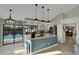 Spacious kitchen features a large island with granite countertops and stainless steel appliances at 101 Green Heron Ct, Daytona Beach, FL 32119