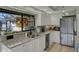 Kitchen with granite countertops and stainless steel appliances offers ample storage at 101 Green Heron Ct, Daytona Beach, FL 32119