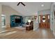 Comfortable living room featuring a built-in entertainment center, cozy sectional sofa, and lots of natural light at 101 Green Heron Ct, Daytona Beach, FL 32119