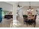 Open concept living room and dining room features vaulted ceilings and new flooring at 101 Green Heron Ct, Daytona Beach, FL 32119