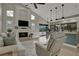 Open-concept living area features a fireplace, high ceilings, and seamless flow into kitchen at 101 Green Heron Ct, Daytona Beach, FL 32119