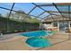 Beautiful screened-in pool and hot tub with ample deck space for entertaining and privacy hedges around the perimeter at 101 Green Heron Ct, Daytona Beach, FL 32119