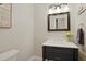 Cozy powder room features modern fixtures, charming decor, and adds a touch of elegance at 101 Green Heron Ct, Daytona Beach, FL 32119