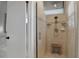 Bathroom featuring a nice shower with a seat, shelving, and modern design at 101 Green Heron Ct, Daytona Beach, FL 32119
