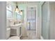 Bathroom with a modern single sink, and a glass-enclosed shower at 106 Banyan Dr, Ormond Beach, FL 32176
