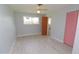 Bedroom with wood-look flooring, a window, closet with louvered doors at 106 Banyan Dr, Ormond Beach, FL 32176