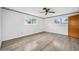 Bright and airy bedroom featuring hardwood floors and ample natural light at 106 Banyan Dr, Ormond Beach, FL 32176