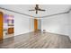 Bright bedroom with hardwood floors adjacent to an en suite bathroom at 106 Banyan Dr, Ormond Beach, FL 32176