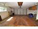 Large, empty garage with a two-car garage door and storage space at 106 Banyan Dr, Ormond Beach, FL 32176
