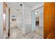 Hallway leading to laundry room featuring white washer and dryer at 106 Banyan Dr, Ormond Beach, FL 32176