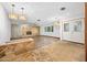 Spacious living room with stone fireplace, hardwood flooring, and custom lighting fixtures at 106 Banyan Dr, Ormond Beach, FL 32176