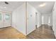 Bright room featuring elegant double doors and sleek hardwood flooring at 106 Banyan Dr, Ormond Beach, FL 32176