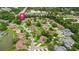 An overhead view highlights the property's location within a community with lush landscaping and serene ponds at 12 Big Buck Trl, Ormond Beach, FL 32174