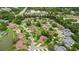 A high-angle view shows the beautiful neighborhood with lush landscaping and winding streets at 12 Big Buck Trl, Ormond Beach, FL 32174