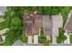 Aerial view of townhouses showing the roof, driveways, and surrounding green trees at 12 Big Buck Trl, Ormond Beach, FL 32174