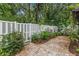 A private backyard offers a white fence with plenty of room for outdoor entertaining and relaxation at 12 Big Buck Trl, Ormond Beach, FL 32174
