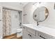 Bathroom featuring new vanity, round mirror, tub and shower at 12 Big Buck Trl, Ormond Beach, FL 32174