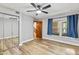 Bedroom with a ceiling fan, window with curtains and mirrored closet doors at 12 Big Buck Trl, Ormond Beach, FL 32174