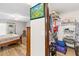 Bedroom with wood-look floors, closet, and an exterior door at 12 Big Buck Trl, Ormond Beach, FL 32174